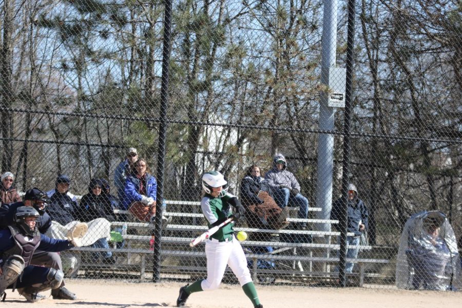 Varsity softball splits in a non-conference doubleheader with Mona Shores