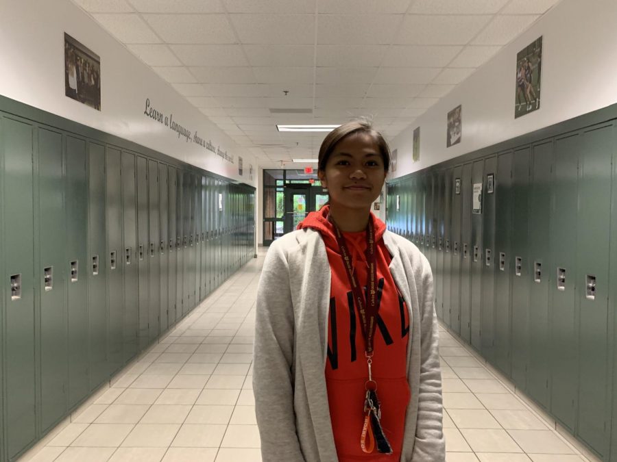 Senior Nicole Aquino  poses in the hallway of Forest Hills Central High School 