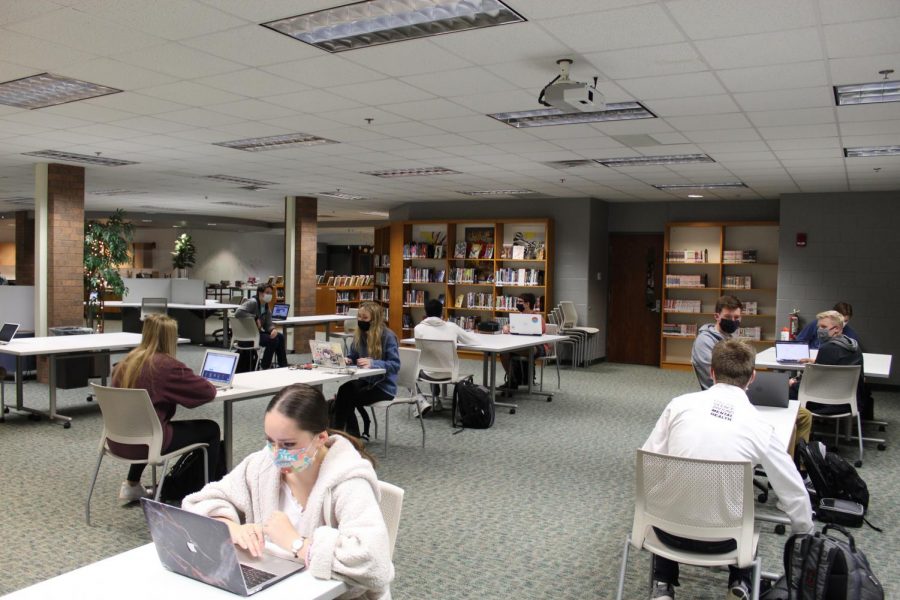 Pictured here are students spreading out as best as possible in the media center for an online-based class as FHC returns to a full-time schedule.