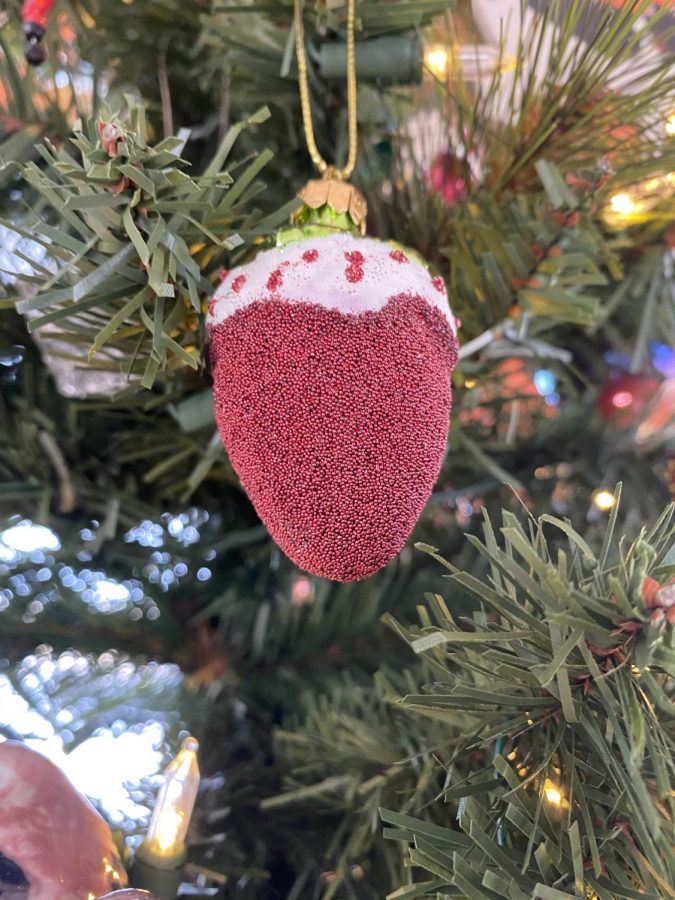 Several strawberries ornaments hang in various places around our christmas tree.