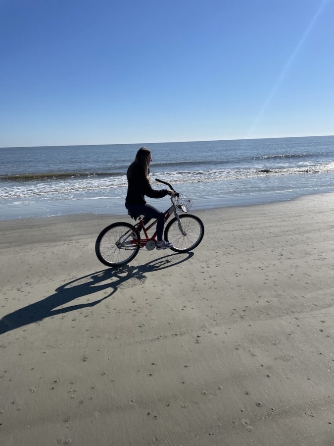 Me, giving off main character energy, at Hilton Head Island biking on the beach last month.