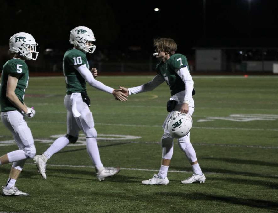 Senior Maguire Mahacek and junior Hunter Robinson doing what Maguire calls their famous, buttery handshake.