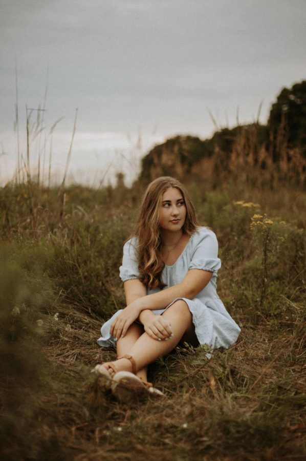 One of my many senior photos taken in the middle of a field right before it rained.