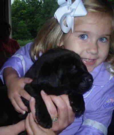 A picture of me from several years ago when I went with my aunt and uncle to pick up their new dog