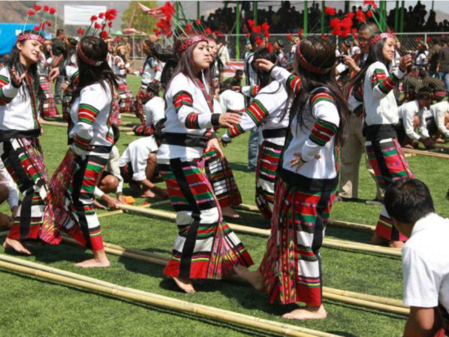 The Mizo tribe performing a traditional bamboo dance at a traditional festival