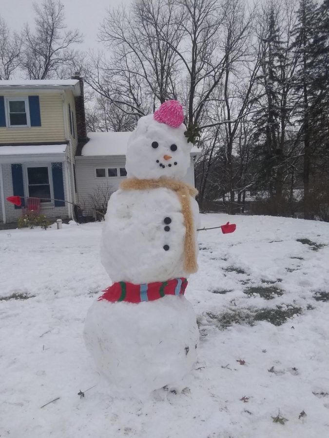 A snowman I built last year around Christmas that is taller than me.