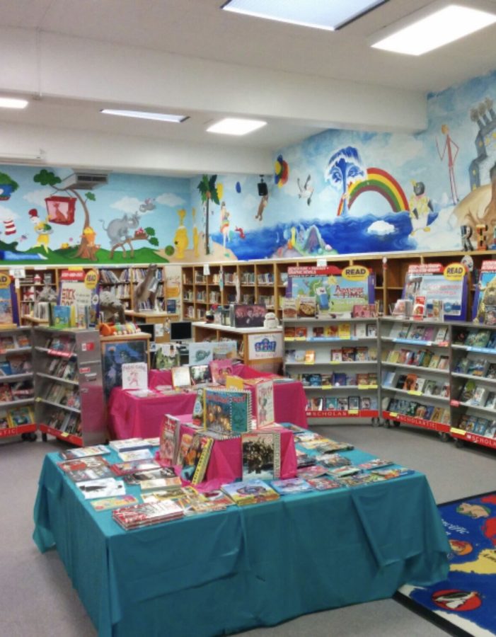 A picture of an infamous Scholastic Book Fair set up in a school library.