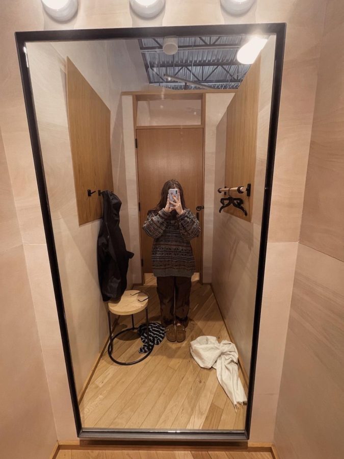 A wide-angled photo I took of me in the Urban Outfitters dressing room (I did not buy the sweater or the jeans). 