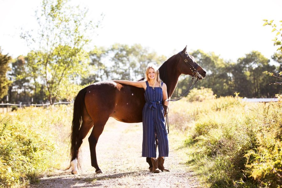 Senior+Claire+Richardson+poses+for+a+senior+photo+with+a+horse