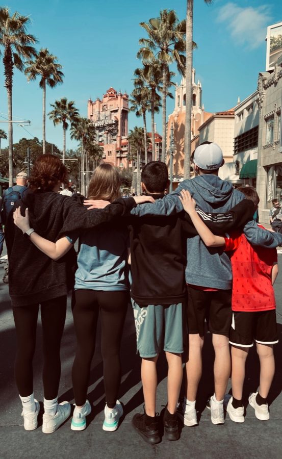 Me, my brother, and my three cousins stand on Hollywood Blvd in Hollywood Studios. 