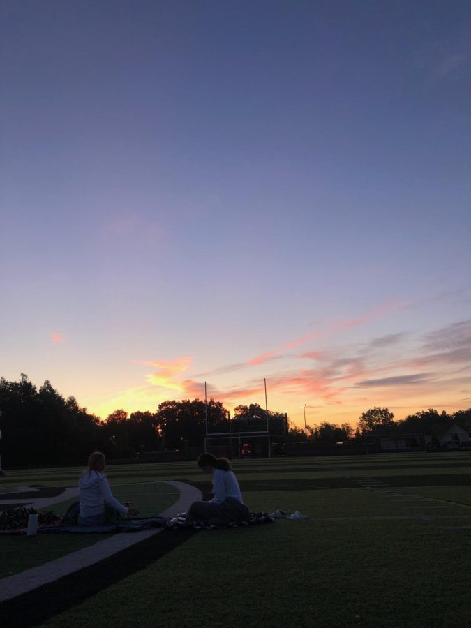 A picture from the senior sunrise when I sat with my friends making memories