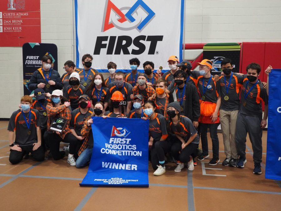 Here+is+a+picture+of+the+robotics+team+after+winning+their+first+competiton+of+the+season
