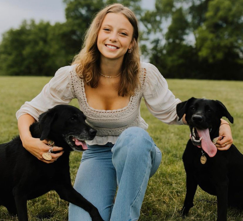 here is a photo of Remington Ingraham and two dogs