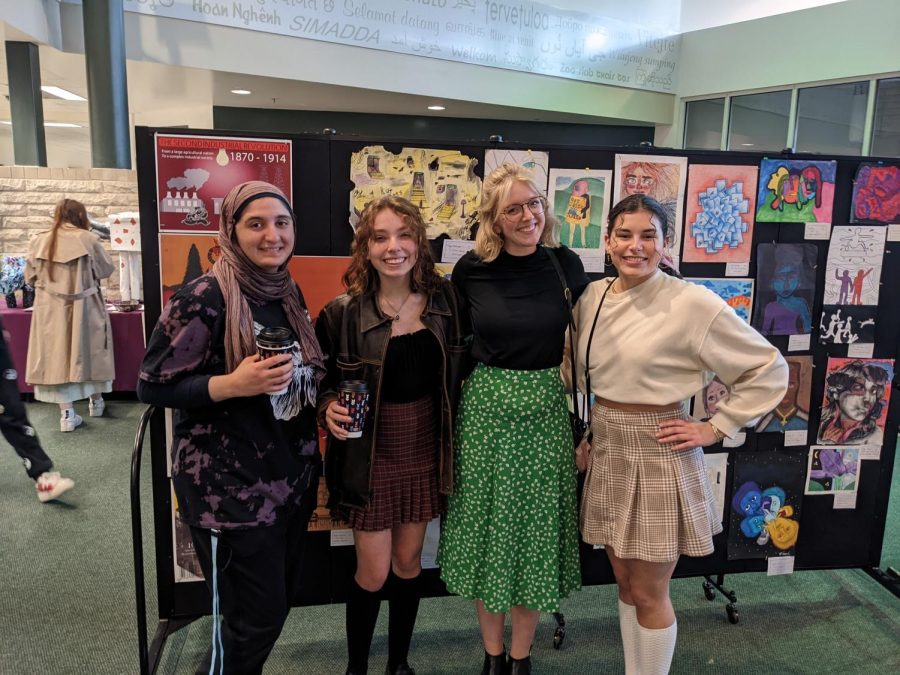 Grace Stynes with some of her students at the FHC Art Show
