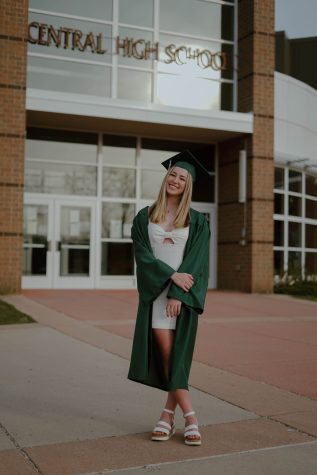 A photo from my Cap and Gown photoshoot, one that makes it feel all too real