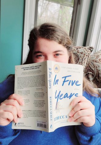 A photo of me holding one of my favorite novels by Rebecca Serle