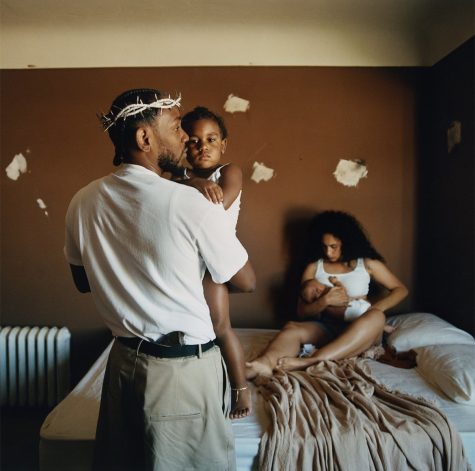 The crown, his soon-to-be wife, their two kids, and Kendrick all present in the album photo.
