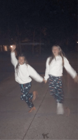 My best friend and I dancing in my driveway in the summertime.