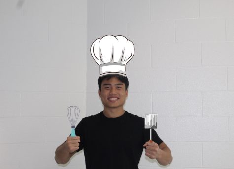 Senior Gavin Cai posing with his chef hat 