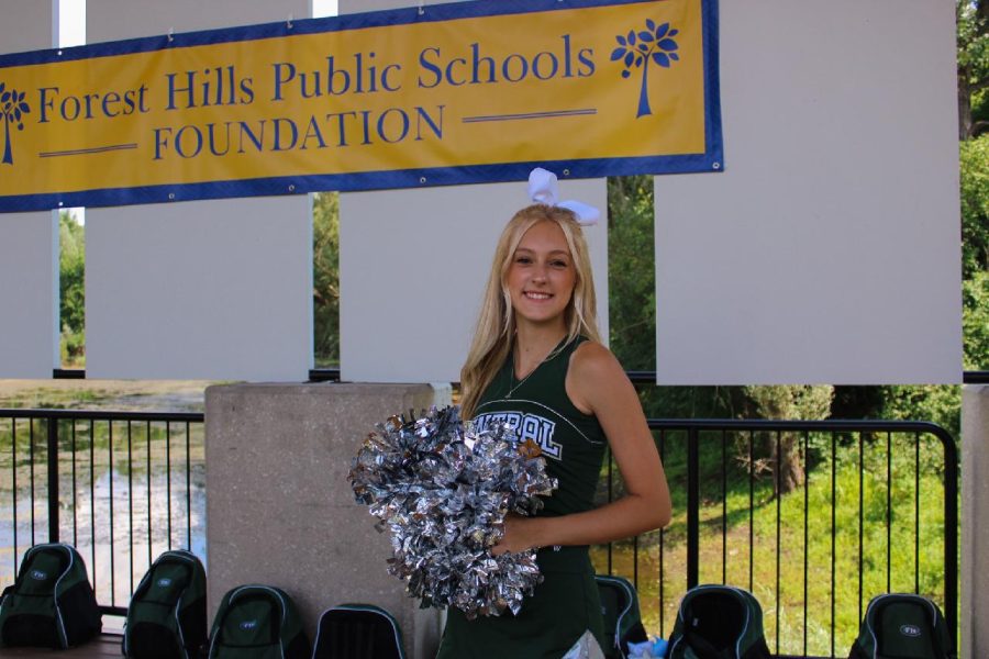 An image of junior Hannah Levering in her cheer uniform