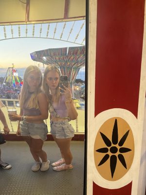 Maya and I in a fun house mirror this summer looking much shorter than normal.