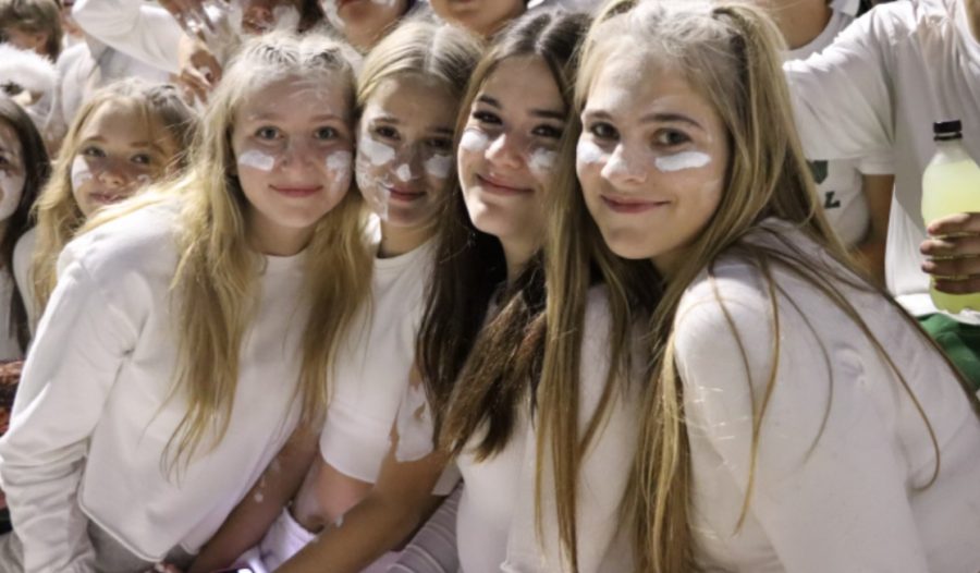 Sophomore Paige Jacobs (second from right)
 with a couple friends at a football game