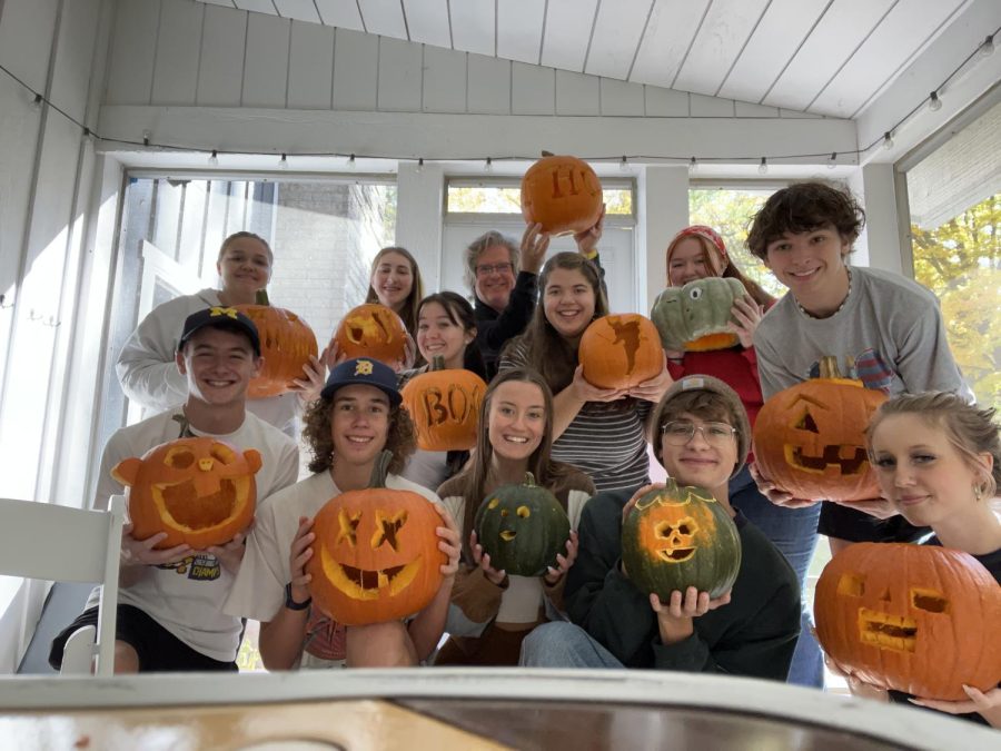 Members from The Central Singers proudly displaying their  carved pumpkins