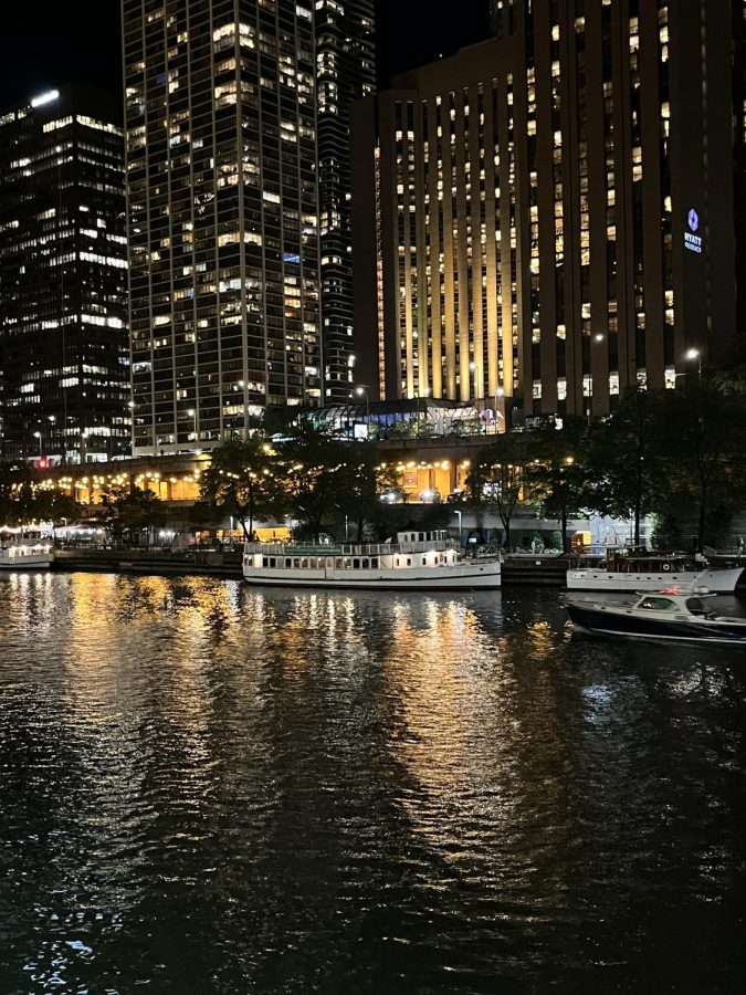 A photo of the Chicago River and the lights at night time
