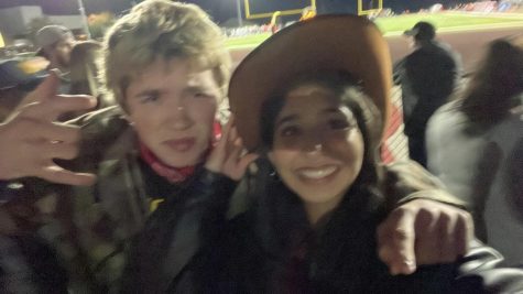 Eshana (right) with her friend, sophomore Charlie Molitor at a football game