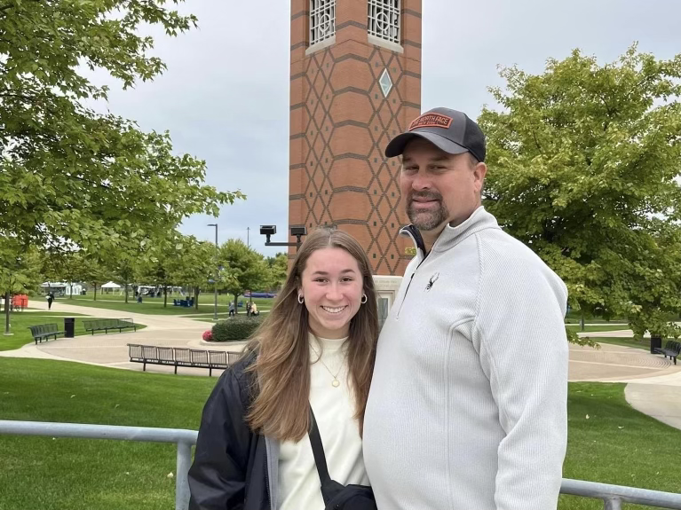 A picture of Mady and her dad at the college she will soon be attending: Grand Valley State University