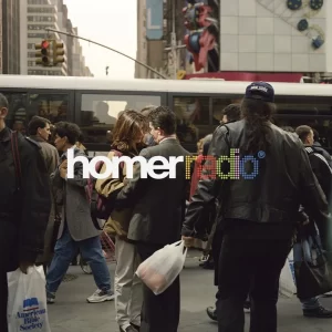 A candid photo of a normal work day in a bustling city - front cover of Homer Radio