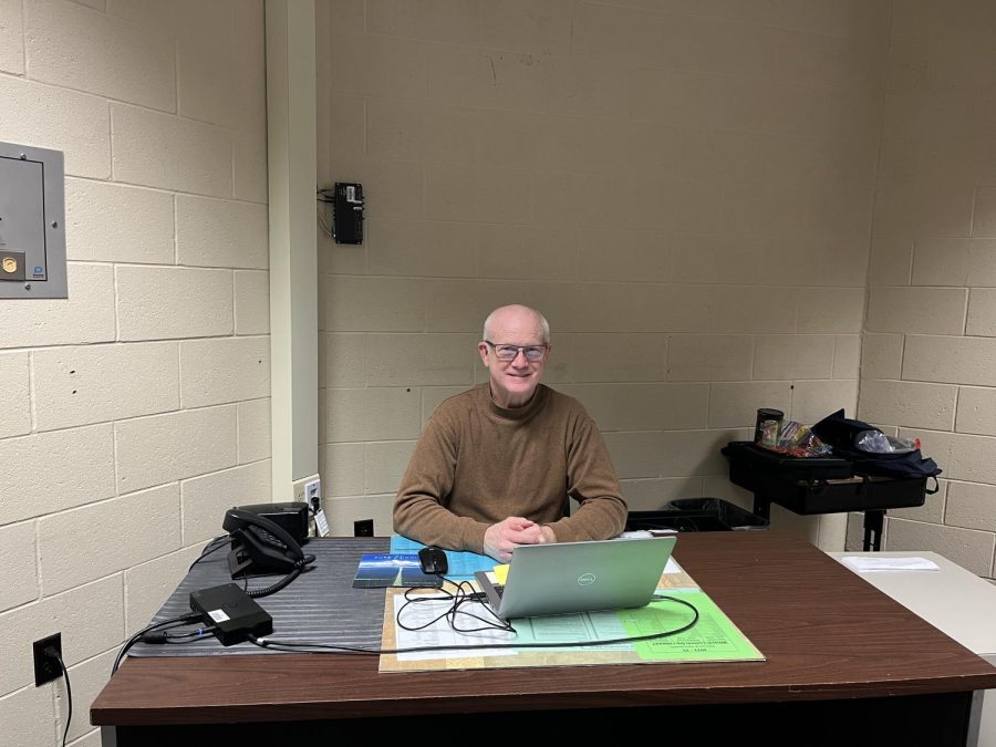 Dr. Lambach sitting at his desk inside the testing center