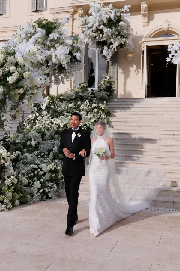 Sofia Richie Grainge walking down the aisle at her wedding with her father, Lionel Richie.