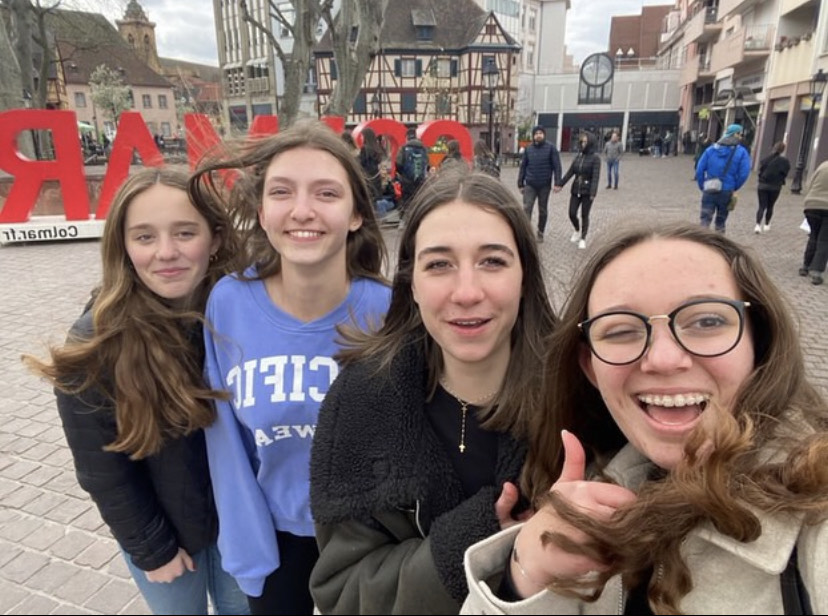 A picture of Victoria, her host sister, and other people she met in France