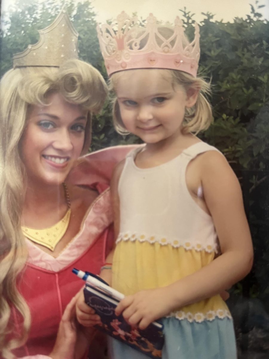 A younger me in my carnation pink crown with the princess I used to dress up as.