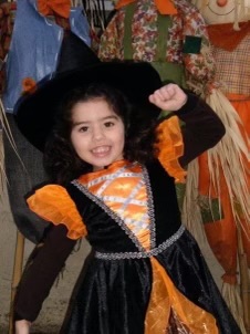 Me at three years old in my witch costume for Halloween.