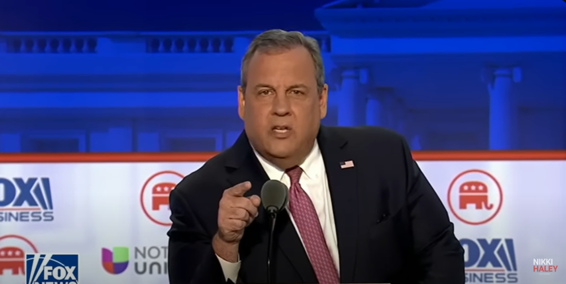 Chris Christie points right at the camera as he calls out Donald Trump for not participating in the Republican primary debates.