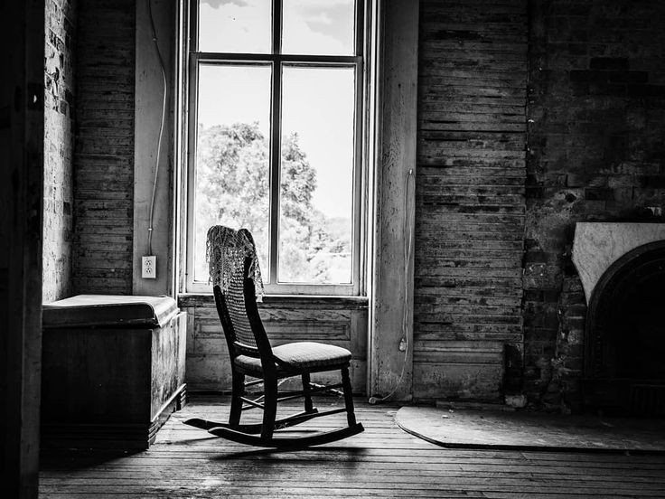 A chair sits alone, not bruised nor buried, not touched but not loved. 