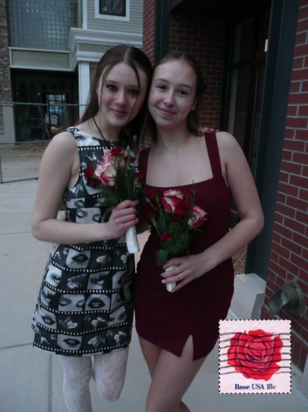 A photo of me and Elle holding roses on Winterfest.