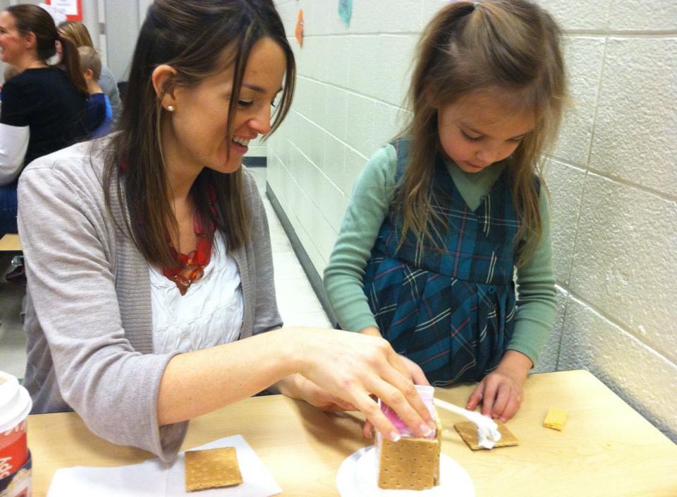 My mom and I making milk carton gingerbread houses.