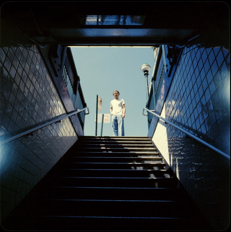 Josh Harmon descends into a dark subway  station just as his album descends into dark desensitization.