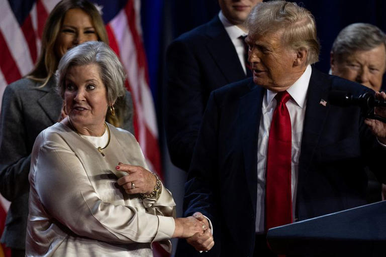 Susie Wiles (left) and Donald Trump (right) shaking hands following the early results from the 2024 U.S. presidential election in Palm Beach County Convention Center