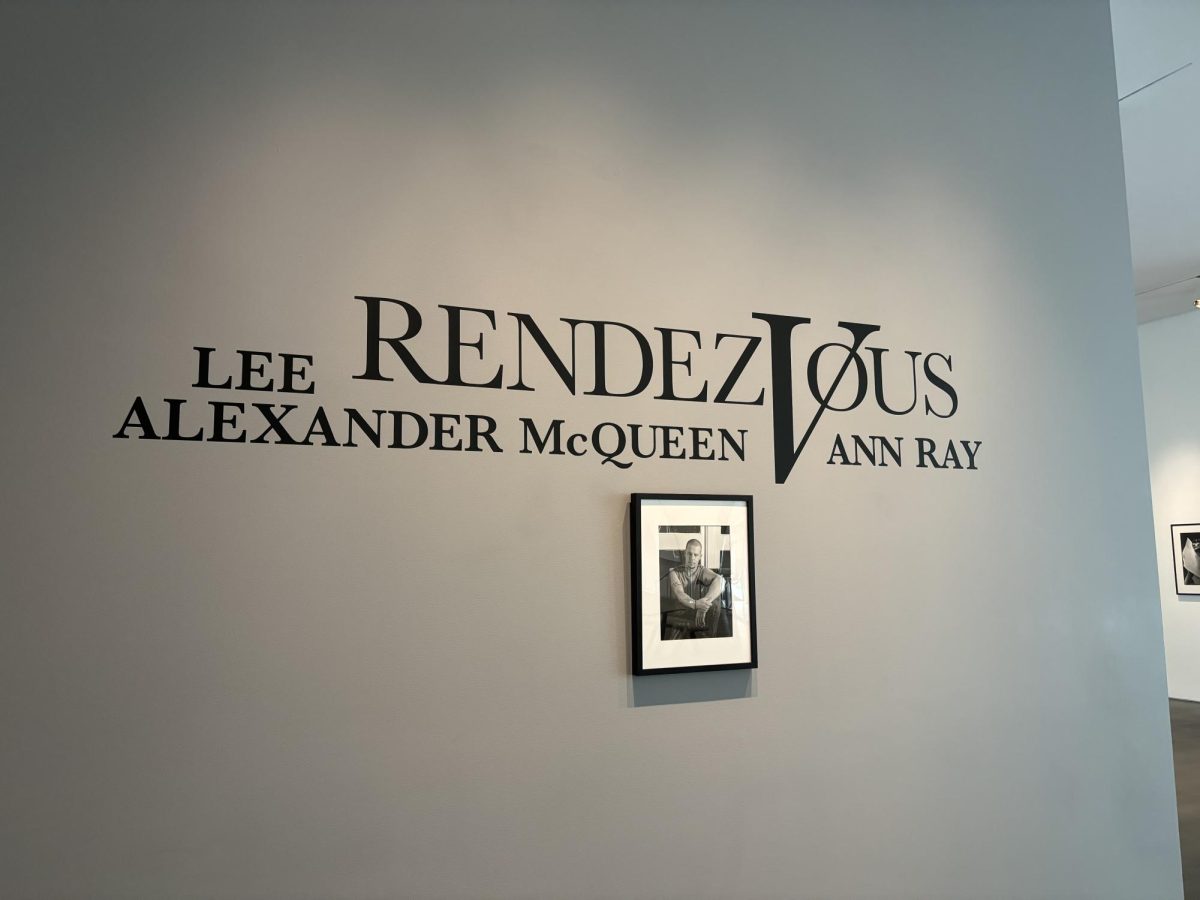 The entrance to “Lee Alexander McQueen & Ann Ray: Rendez-Vous”, featuring the exhibit's title with an image of McQueen. 