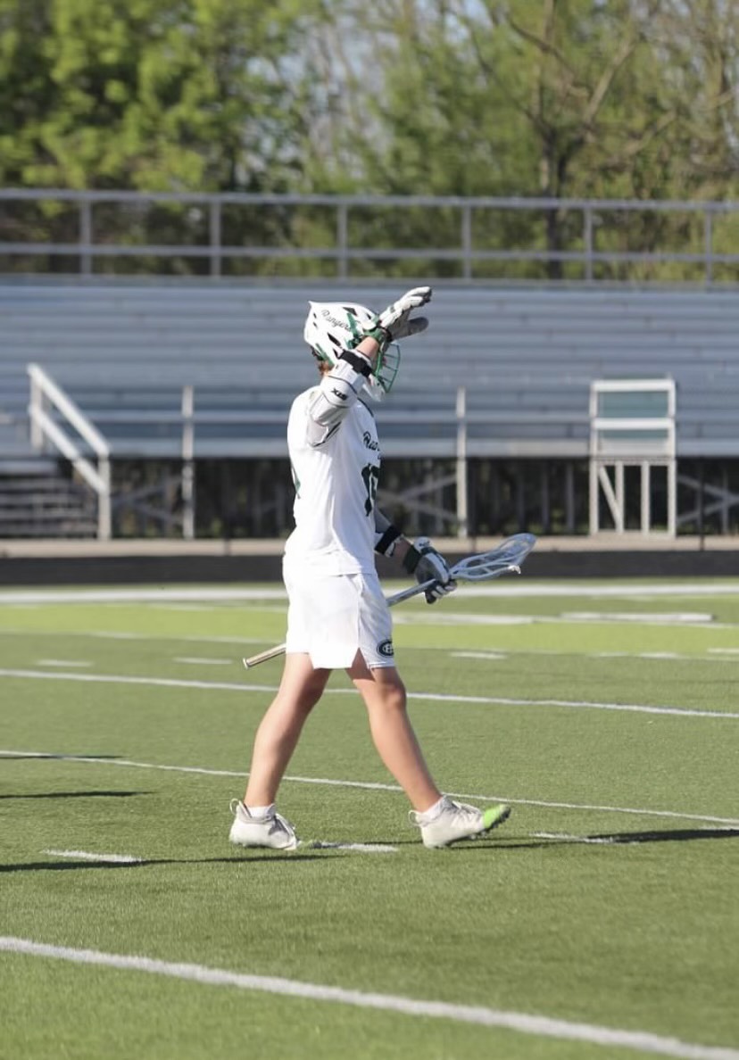 Henry McNamara playing lacrosse his sophomore year of high school.