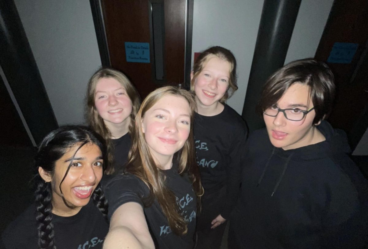 Audrey Milanowski (back right) with the fellow stage crew members that she works with behind the scenes.