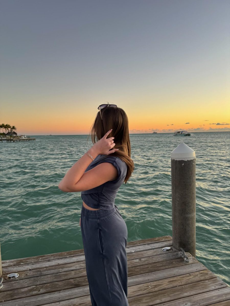 I love our annual dinners at Sunset Grill on New Years Eve, where I drag my mom to take photos of me on their dock. 