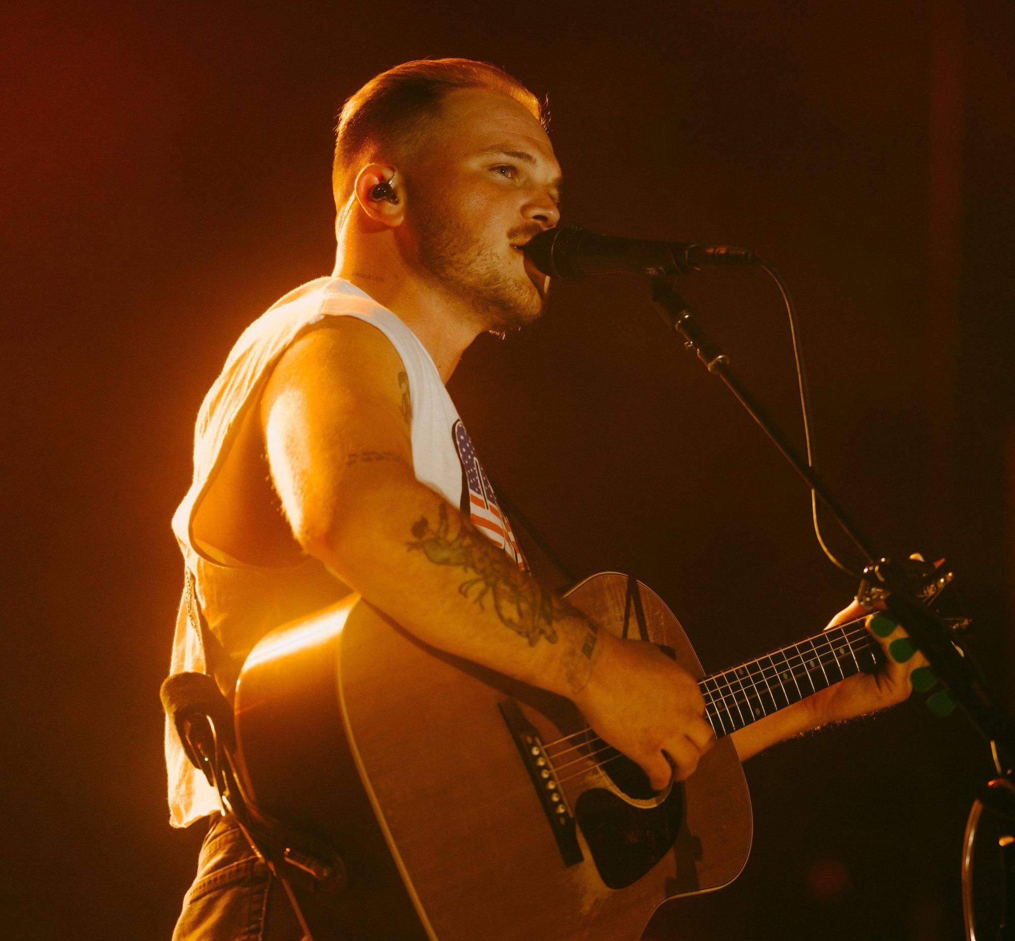 An Oklahoma native, Bryan takes listeners on a cross-country road trip on "With Heaven On Top," from the elusive Pacific Coast to Michigan's own Ann Arbor. 