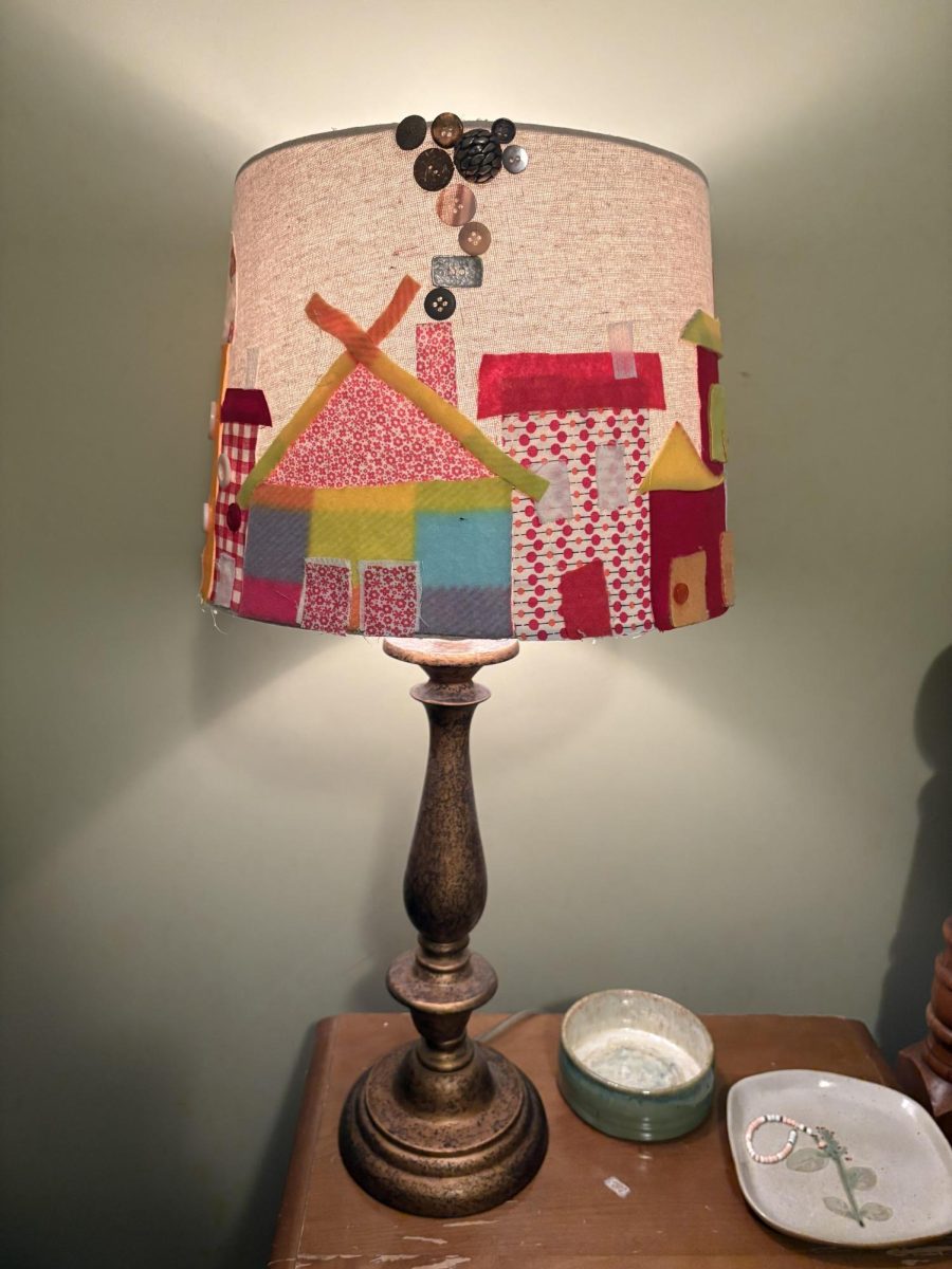 I also created a whimsical lampshade out of leftover fabric, buttons, and a truck load of hot glue.